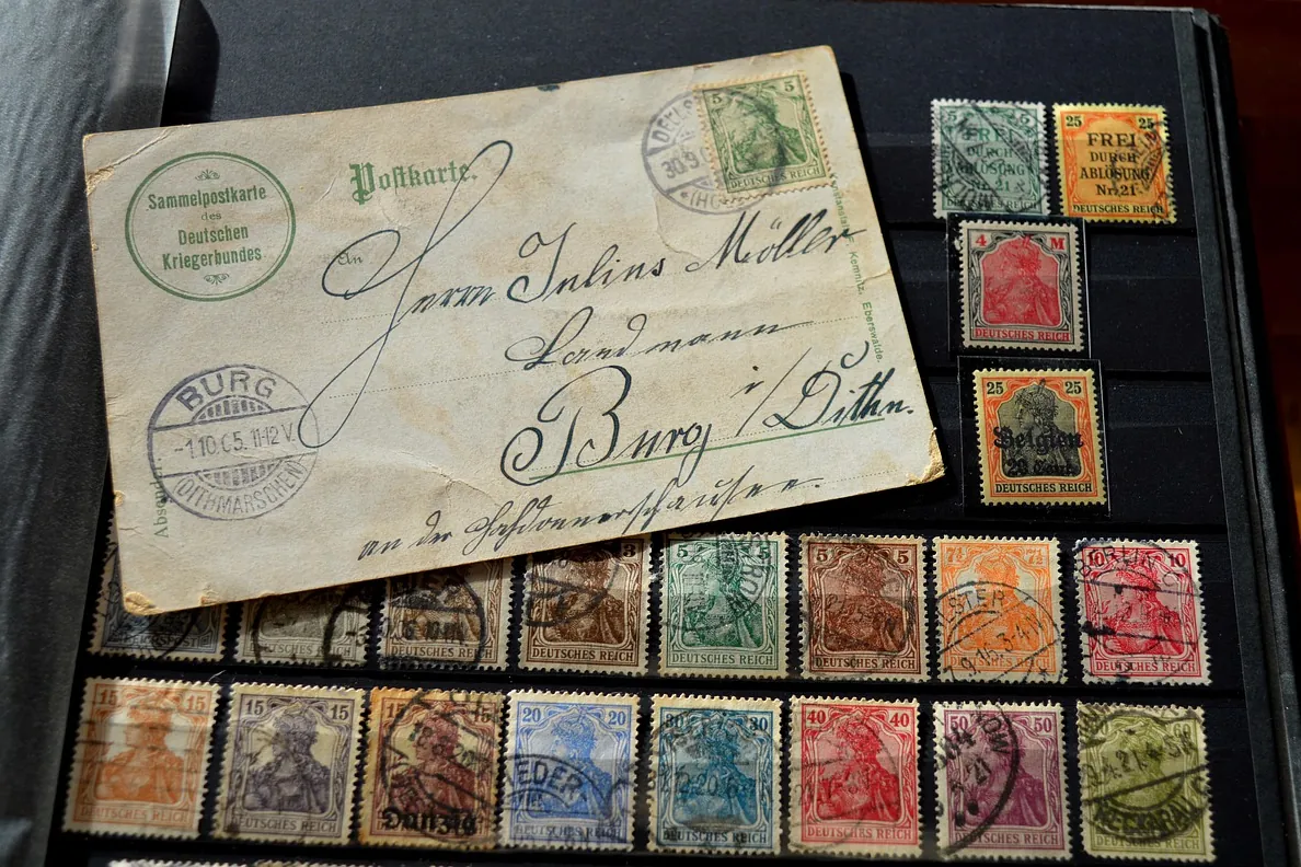 Stamp album, stamps, postcard