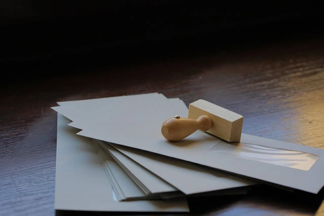 Envelopes, letters, wooden stamp