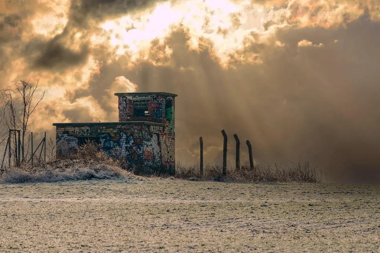 Watchtower, sunbeams, sunset